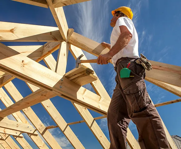 Top-rated vacation home builders crafting a modern lakeside retreat with panoramic views.